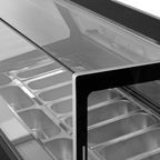 Close-up of the LUXE15 glazed display and stainless-steel Napoli pans